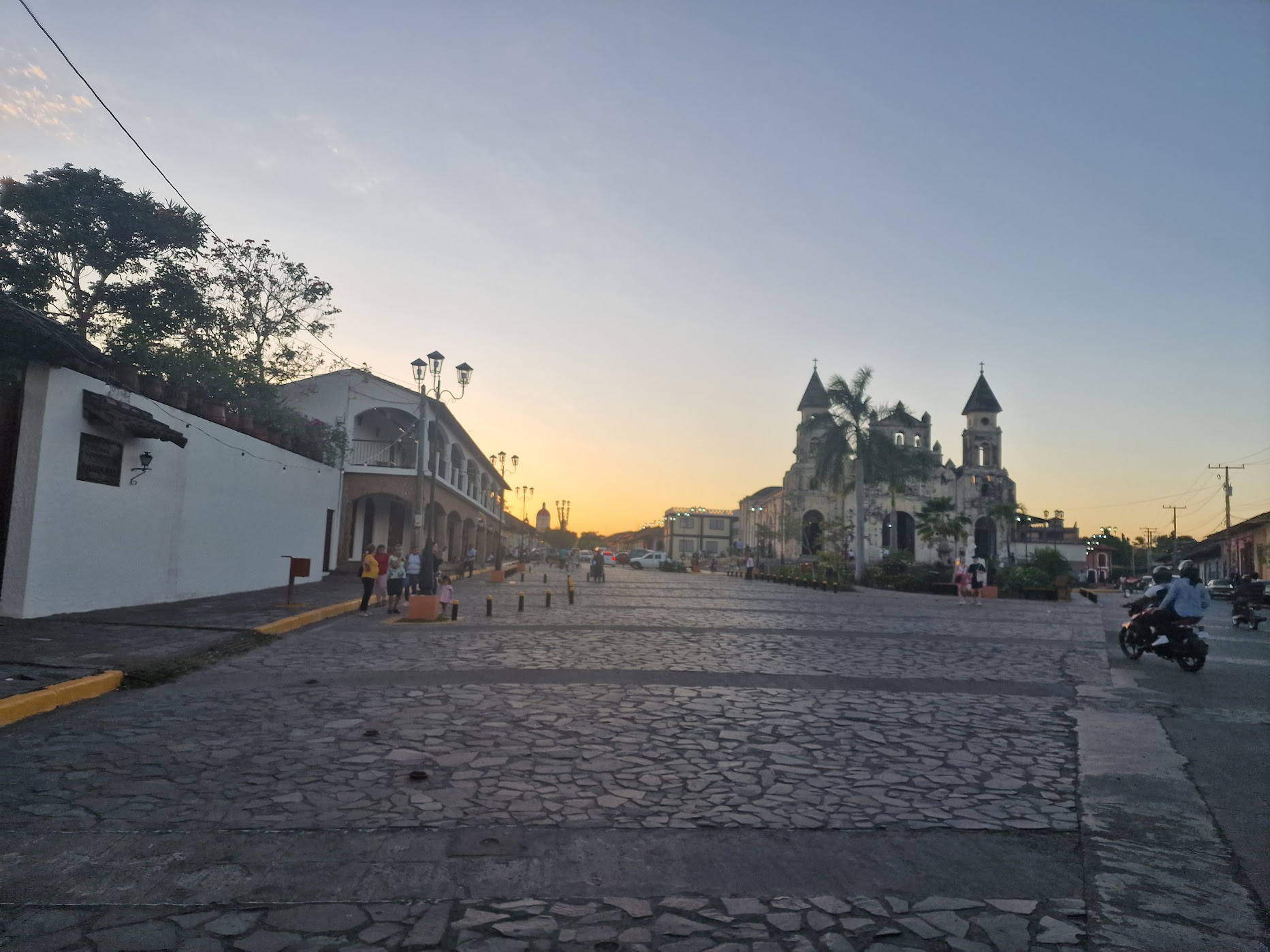 Colonial street and church towers at dusk in Granada, Nicaragua